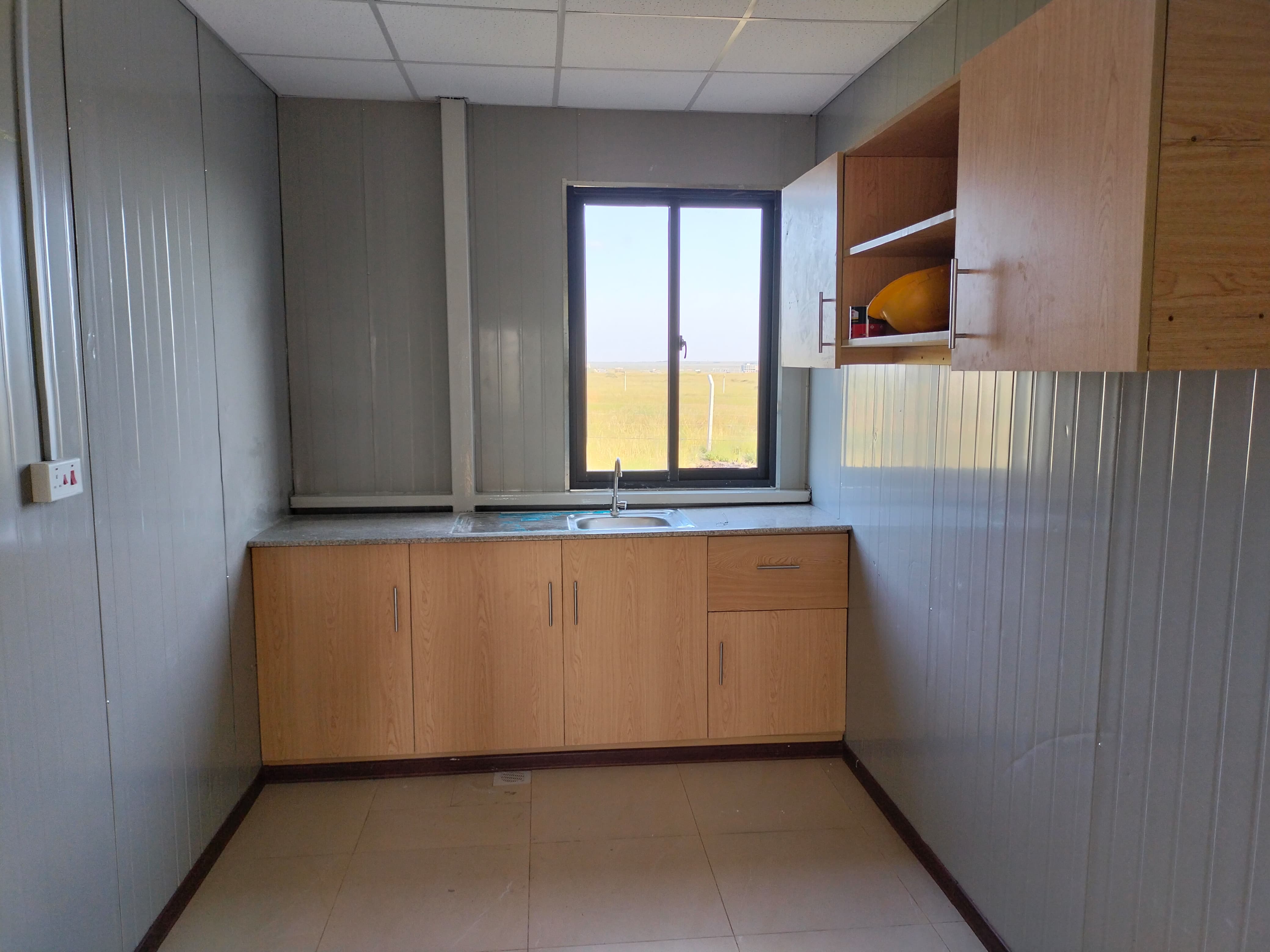 Supply and installation of kitchen cabinets